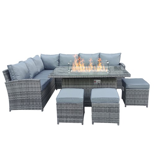 Woven corner lounge sofa with cushions and a fire pit table