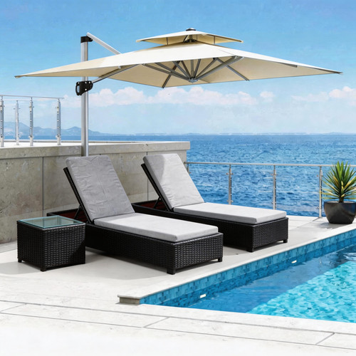 Two woven reclining sun loungers with cushions and a small side table